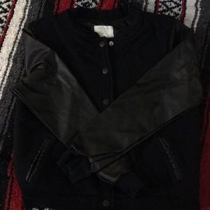 Black “letterman’s” style jacket.